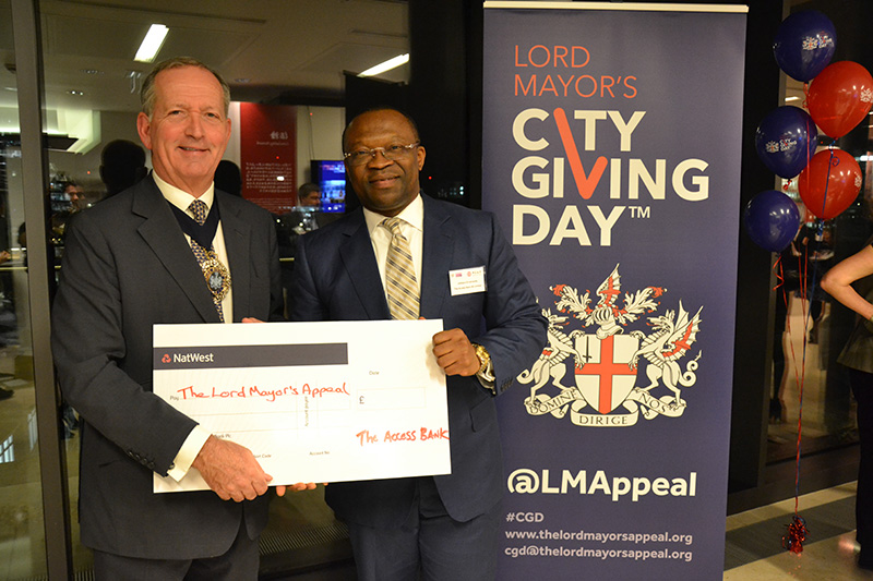The Lord Mayor receives a cheque from Johnson Ememandu, Head of Commercial Banking at The Access Bank UK.
